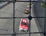 Fan facing charges after fence climb during Dover Cup race
