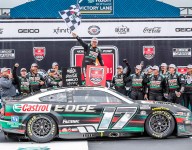 Buescher wins a weather-delayed nail-biter at Michigan